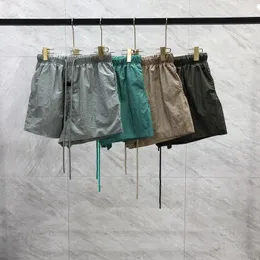 24SS Spring Summer Europe USA Little Silicone Logone Logon Working Metal Metal Nailon Shorts Женщины мужчины Скейтборд Хай -стрит Бегут Средние брюки, пробежающие короткие спортивные штаны 0523