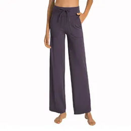Pantaloni da yoga a gamba femminile sciolti comodi pantaloni della tuta con coregne con tasche casuali pantaloni svasati a vita alta
