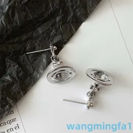 2024 Designer Luxury Xitai Queenjewellery Stud Nana Cross Niche Net Red Planet Saturn Earrings Three-dimensional Ufo Pendant Earrings