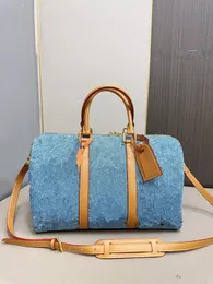 La borsa da viaggio in denim, la borsa per cuscino, la collezione di moda primaverile ed estiva, questa volta lo stile è sorprendente, può essere trasportato da uomini e donne, fresco, bello, carino e adorabile.