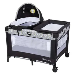 Baby Trend Nursery Center Travel Crib med avtagbar rock-a-bye bassinet, omklädningsbord, arrangör, elektronisk musikcenter