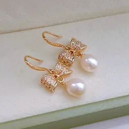 蝶の結び目女性のための白いナチュラルパールドロップイヤリング耳の宝石78mm楕円形の淡水ダングルボウノット240401