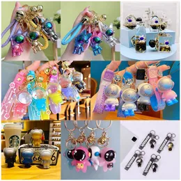 Cartoon creative interstellar exploration astronauts, teddy bear keychains, super cool and colorful space picture pendants, exquisite and cute small gift wholesale