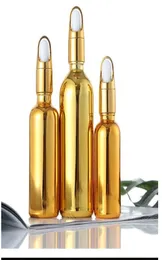 Goldkosmetik ist in Flaschen abgefülltes Goldglas, ätherisches Öl, gepresste Flasche, Sprühflasche, Tropfflasche, Alkohol, Desinfektionsmittel, leere Flasche7671653