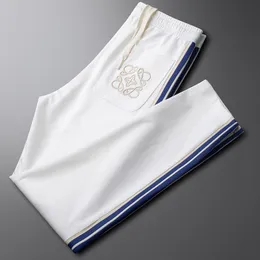 Man Racksuits Designer Pant nova calça de luxo simples Tie Trendy Fet Slim Fit Sports Guards para homens Esporte