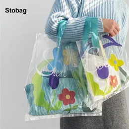 أكياس التخزين Stobag 50pcs تسوق شفاف حقيبة بلاستيكية زهرة الفتاة ملابس التغليف الشعار المخصص المحمول (رسوم إضافية)