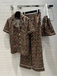 Luksusowa marka szerokopasmowych spodni z torbą dla kobiet 2024 Summer Lapel Lady Button Drukuj trzyczęściowy zestaw dresowy