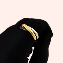 Anelli di designer retrò per donne Trinity Trinity Simple Charm Elegante lettera Elegante anelli in oro a piacimento liscio uomini Tre colori Dono anello nuziale ZL203 B4