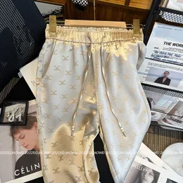 Kwas octowy jedwabne spodnie szerokokadłubowe spodni dla kobiet 2024 Nowe cienkie szczupłe spodnie satynowe spodnie swobodne