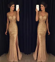 Bling New Sexy Gold Mermaid Veal Dresses Ware v Neck Crystal Corme Side Split Tulle Illusion Sheer Party Party Prom D5721296