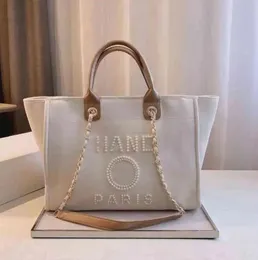2024 designer borse da spiaggia di grande capacità borse di lussuoso perle da mare da donna borse per spalle borse per la spesa borsone borsetta