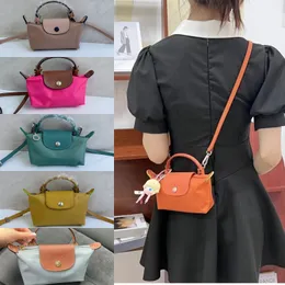 Lyxig dumpling kosmetisk väska mini shoudler tote hobo designer liten väska handväska mens kvinnor koppling nylon pochette xs crossbody väskor plånbok handväska