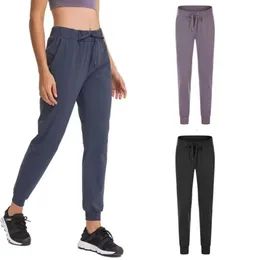 Pantaloni della tuta da yoga con coulisse ad alta vita per pantaloni di asciugatura rapida da donna con abbigliamento sportivo per il fitness aderenza per il fitness allentati con leggings