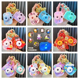 Wholesale of new cartoon creative mini projection camera keychains, luminous decompression puzzle toys, key pendants, small gifts