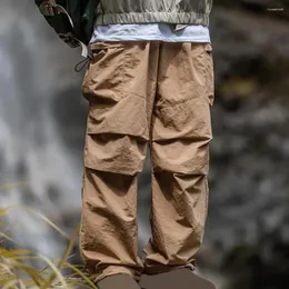 Calça masculina calça ao ar livre com cintura elástica de cor sólida solta de colo multi-bolso acampamento e macacão de montanhismo
