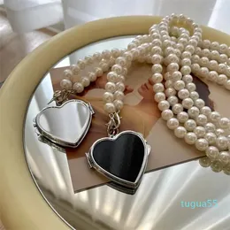 Axelväskor 2024 Pearl Chain Mini Crossbody Bag Fashion Metal Heart Mirror Pendant Decoration Midje Tillbehör