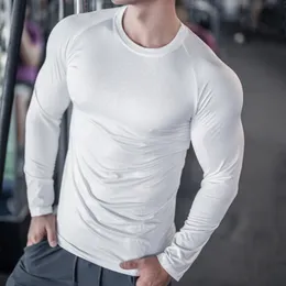 T-shirt a maniche lunghe di primavera autunno maschile in tessuto jacquard asciugatura rapida abbigliamento stretto palestra che corre in allenamento camicia da fondo