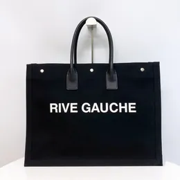 Einkaufstasche Luxus Handtasche Designer -Tasche Großkapazität Einkaufstasche Hochwertige neutrale Handheld Fashion Rive Gauche Logo Leinwand Panel Leder 2024 Sommerreisebeutel