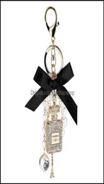 Keychains Fashion Accessories Creative Handmade Diy Diamond Per Bottle Alloy Bow Pearl Luxury Keychain Purses Charm Pendant Ys068 9139927