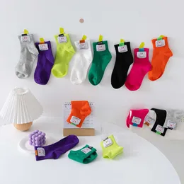 Meias Hosiery Korean versão do rótulo de rosto sorridente para crianças, produtos primavera verão, meias de tecido colorido de doces, meias da faculdade, estilo de faculdade feminino