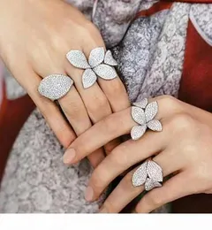 F Infinity Jóias de luxo Real 925 Sterling Silver Pave White Clear 5A Cubic Zirconia Eternidade aberta Ajustável Flor de casamento Ring4936421