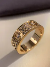 Männliche und weibliche Paar Ring Titanium Stahl rosafarben Gold plattiert Silber Full Diamond Advanced Full Sky Star Diamond Ring Hochzeit Engagement Geschenk