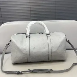 Designer Duffle Bag Bag de luxo Bolsa de viagem Men maquilas de moda Bolsas de marca feminina bolsas de ombro de couro genuínas Mulher