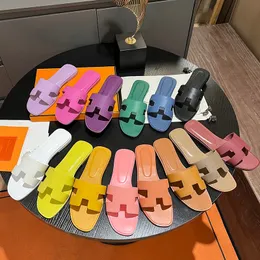 Topp oran casual tofflor läder sandaler sommar lat designer sandal tecknad öppen tå oran flip flops läder dam glider män kvinnor skor äkta läder kohud