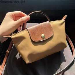 Fabrik högkvalitativ grossist franska longxiang mini dumpling väska kvinnor handväska handväska handtag mobil noll plånbok crossbody