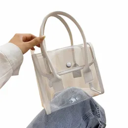 Bolsas transparentes Mulheres projetadas por verão PVC PVC Portátil Simple Student Travel Bag PU Handle All-Match Beach Totes B4NF#