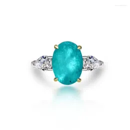 Clusterringe 925 Sterling Silber Weiß vergoldet Blue Stone Synthetic Paraiba Turmaline oval