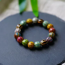Sommar nya fashionabla armband med nischdesign med etnisk stilarmband och konstnärliga keramiska blommig glasyrgradientfärgade pärlband armband