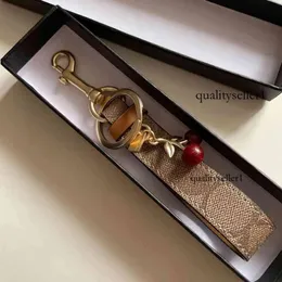 Cherry Charm Keychain سلسلة المفاتيح الفاخرة جميلة صغيرة صغيرة الكرز حلقة مفتاح للنساء حامل حقائب السحر محلي قلادة 2021 سلاسل 719