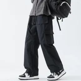 Calças masculinas Capacidade de armazenamento grande carga elástica de cordão com bolsos calças de perna reta de cor sólidas para streetwear