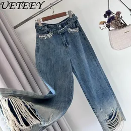 Stazione europea dei jeans femminile sprosata a molla strappata a cinghia vaccucciata per industrie pesanti pantaloni di denim a gamba larga
