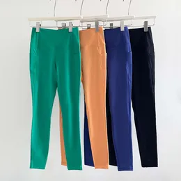 Designer dg9t lulumon leggings femminili nuovi pantaloni da yoga sportivi al fianco della vita alta per donne senza traccia nuda e pantaloni di fitness elastici in tasca