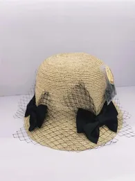 قبعات واسعة الحافة S202403-Xuxu Ins Chic Summer Mesh Bowknot Natural Raffia Grass Sunshade Lady Bucket Cap Women Termure Hat