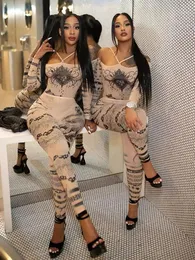 Dziwne puss seksowne See przez kobiety 2 -częściowy zestaw modny serce nadruk slash szyja bodysuitleggings pasujący do północy garnitur w clubwear 240420