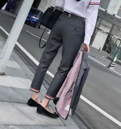 Pantaloni per tubi per tubi da uomo casual maschi e pantaloni a corto sciolti versatili polsini arrotolati pantaloni da business.