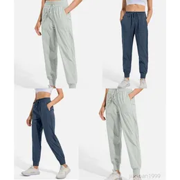 Hot Selling New High Maisted Womens Yoga Pants med mjuka och elastiska fickor som är lämpliga för träning och sportbyxor