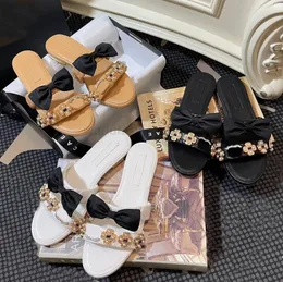 Designer Slippers for Women Summer C Luxury Logo Bowtie Pearl Sides sandals Fashion Charm Casual Bohemian Butterfly Style low heels Dress Shoes