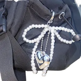 Tornari sansango 1pcs imitazione perla perle perline perle tastiera fatta a mano a forma di molo ornamento del portachiavi per borse e telefoni