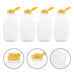 Lagerflaschen 4PCS Transparent Plastik Honigflasche Lebensmittelverpackungsglas mit Deckelmarmarning für zu Hause (500 g