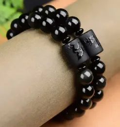 Perlen 10/12mm natürlicher schwarzer Obsidian geschnitzter Buddha Lucky Amulett Rundkiltzerlen Saitenarmband geeignet für Frauen Männer Schmuck und Neujahrsgeschenke