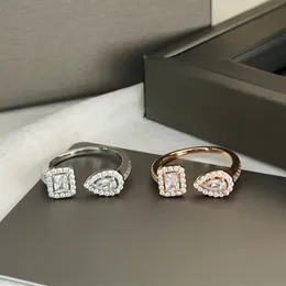 Gli anelli di design si muovono uno con diamond mutil in stile dimensione 5 6 7 8 per il regalo di gioielleria da sposa con scatola