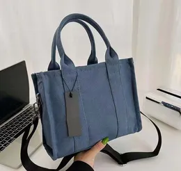 Дизайнерская сумка сумки сумки женская дизайнерская холст сумка 27 см на открытом воздухе пляжная сумка кошелька для плеча с кросс кумо