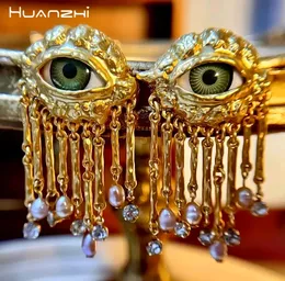 Huanzhi Personality Eyes Серьги с заводом Золотой металлический жемчужный кисточка для женщин девочки медные европейские американские винтажные ювелирные изделия 240416