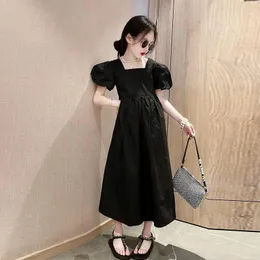 Vestidos da menina preto sólido meninas vestido de manga curta verão 2024 versão coreana princesa longo moda médio e grandes crianças