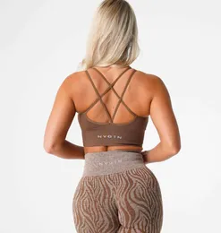 NVGTN Yoga Outfits Sutiãs SEXYFlourish Sutiã sem costura Sports Bralette Gym Fitness Tops Active Outfits Multi Strappy Almofada removível Nylon Desgaste de exercício