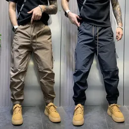 Calças cargo masculinas com zíper bolso grande calças táticas militares casuais cor sólida ao ar livre harem sweatpants roupas de marca 240126